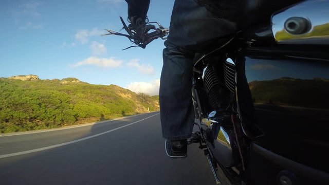 Biker Riding A Classic Motorcycle Seen From The Lift Side