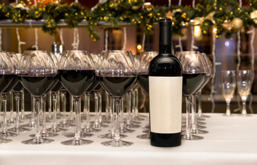 Catering. Glasses and bottle with red wine.