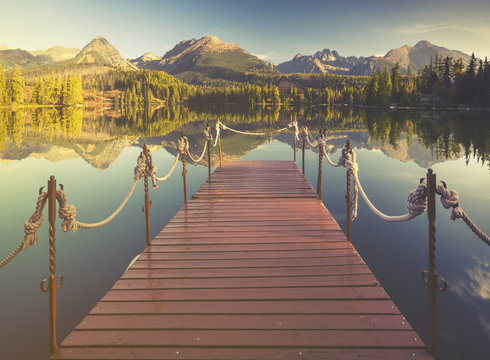 High resolution panorama of the lake in Strbske Pleso,High Tatras,Slovakia.Toned with a retro vintage  effect
