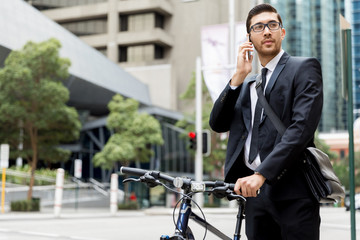 Young businessmen with a bike