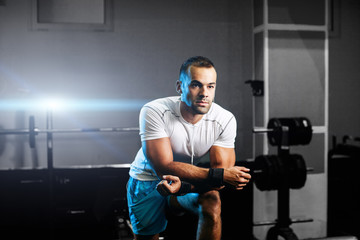 Fototapeta na wymiar handsome fitness trainer in gym