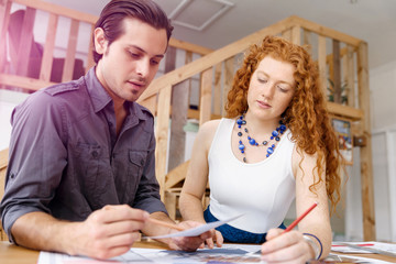 Obraz premium Two young architects in office