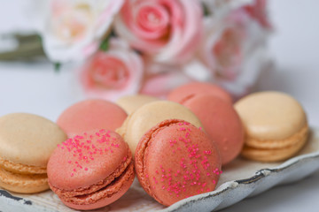 Plate of fresh colorful macarons. Shallow depth of field.