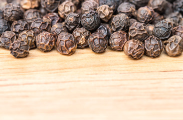 Obraz premium Macro of black peppercorns - black pepper grains.