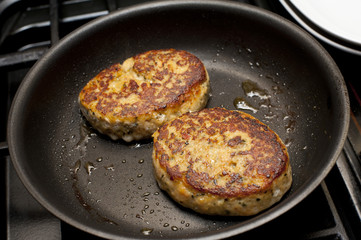 Fried fish pattiesin a pan