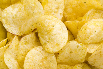Close up potato chips on top view background.