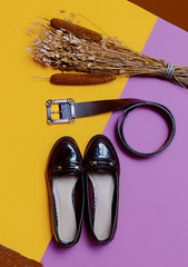 Fashion Accessories autumn season. Belt and varnished shoes. Be