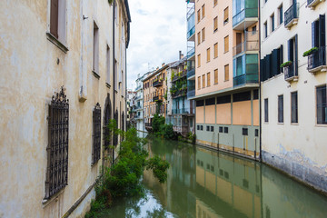 Fototapeta na wymiar canal San Massimo runs among residential houses in the centre of the old city Padua