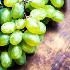 Green grape, country rustic style, close up with copyspace. Whit