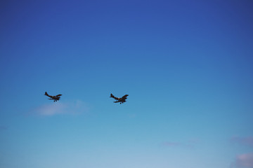 Pair of biplanes against a blue sky Vintage Retro Filter.