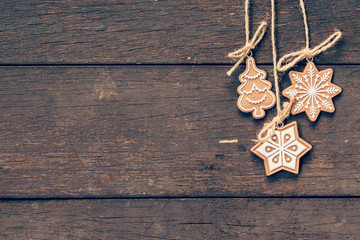 christmas decoration hanging on wood background with copyspace.