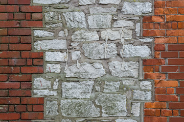 Mixed brick and stone wall background texture