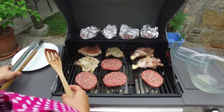 POV: Grilling meat on barbecue