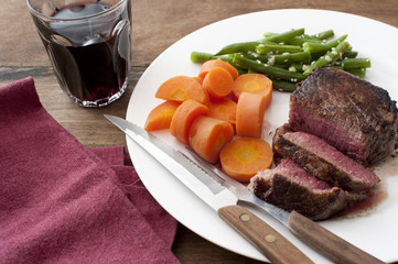 Meal of grilled steak, Diced Carrots and Green Beans