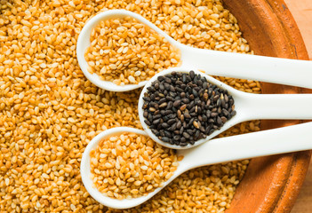 White sesame seed , black sesame seed, in earthenware,  the ingredients of Asia food and sweet dessert