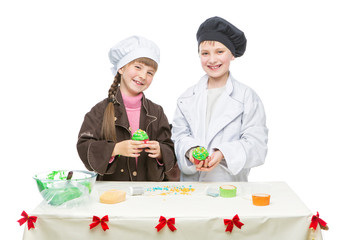 Children making christmas cupcakes