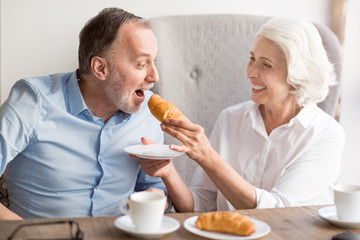 Cheerful loving couple resting in the cafe