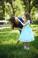 Happy mother and daughter together outdoors