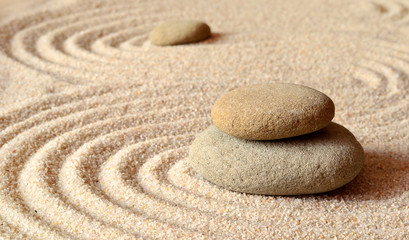 Fototapeta na wymiar stones on the sand with circles