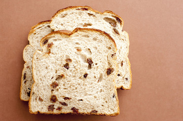 Photo of three slices of bread with raisin