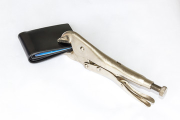 Locking Pliers hold a black wallet money