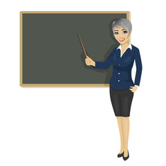 female teacher with pointer standing next to chalkboard