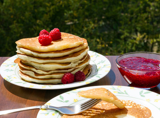 Homemade cakes: Pancake with homemade raspberry jam