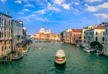 Gorgeous view of the Grand Canal and Basilica Santa Maria della Salute during sunset with interesting clouds, Venice, Italy