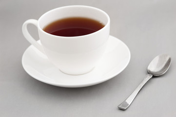 Generic white cup of hot black tea