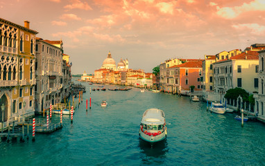 Gorgeous view of the Grand Canal and Basilica Santa Maria della Salute during sunset with interesting clouds, Venice, Italy
