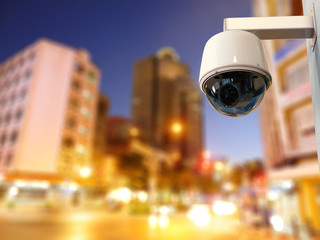 security camera or cctv camera with cityscape background