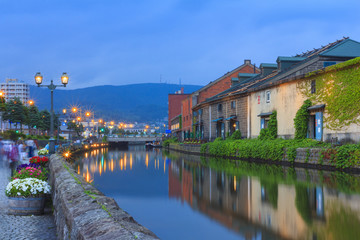 Otaku, Japan historic canal and warehouse in summer twilight time, famous tourist attraction of Sapporo Hokkaido.