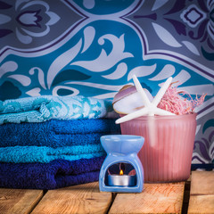 Set towels in blue colors with shells, wisp of bast and candle