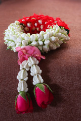 jasmine garland on brown fabric