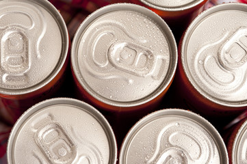 Tops of Cold Soda Cans Covered with Condensation