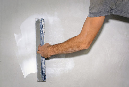 Finishing Coat Of Plaster On The Wall With Grout