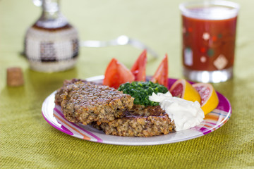 Fried vegetarian cutlet and vegetables