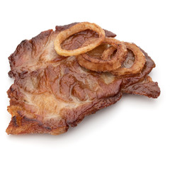 Cooked fried pork meat with onion slices garnish isolated on whi