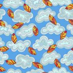 Seamless pattern on the theme of autumn abstract leaves and clouds against the sky