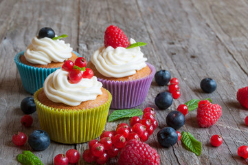 Colorful cupcakes with fresh berries