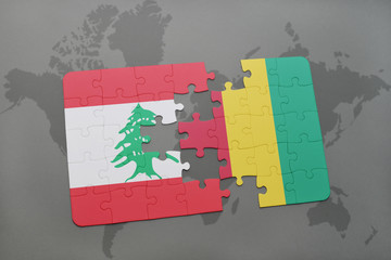 puzzle with the national flag of lebanon and guinea on a world map background.