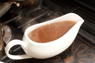 Gravy boat filled with rich hot gravy