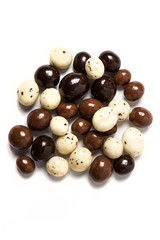 Mixed chocolate covered expresso beans isolated on white background
