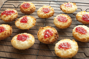Coconut jam cookies over brown table