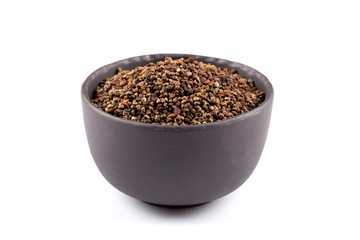 Decorticated cardamom seeds in a bowl