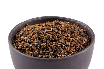 Decorticated cardamom seeds in a bowl