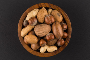 Mixed nuts in shells in a bowl