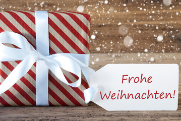 Fototapeta na wymiar Present With Snowflakes, Text Frohe Weihnachten Means Merry Christmas