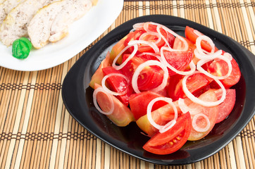 Salad of red and yellow tomato