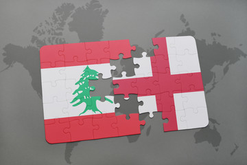 puzzle with the national flag of lebanon and england on a world map background.